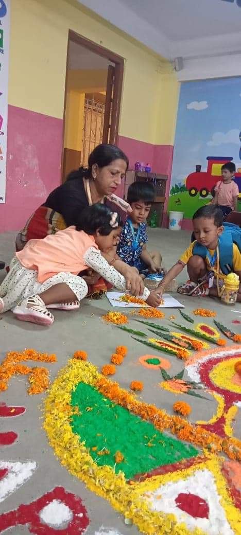 rangoli made with flowers and leaves by the students